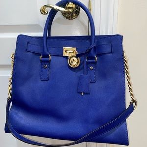 Cobalt blue tote bag with matching wallet. Great condition.